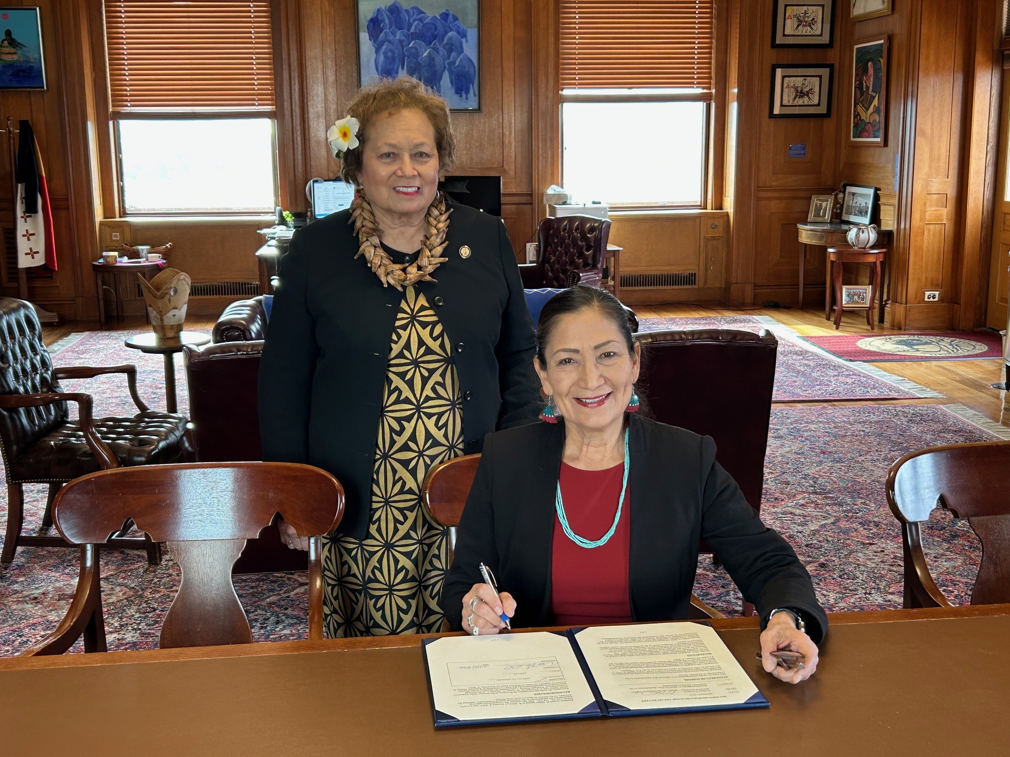 Congresswoman Amata and Secretary Haaland with the signed Decision Memorandum