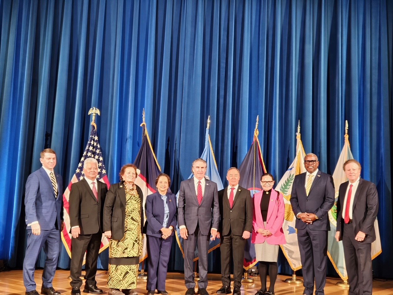 Secretary Burgum (center) with Congresswoman Amata and a number of territory leaders and interagency officials.