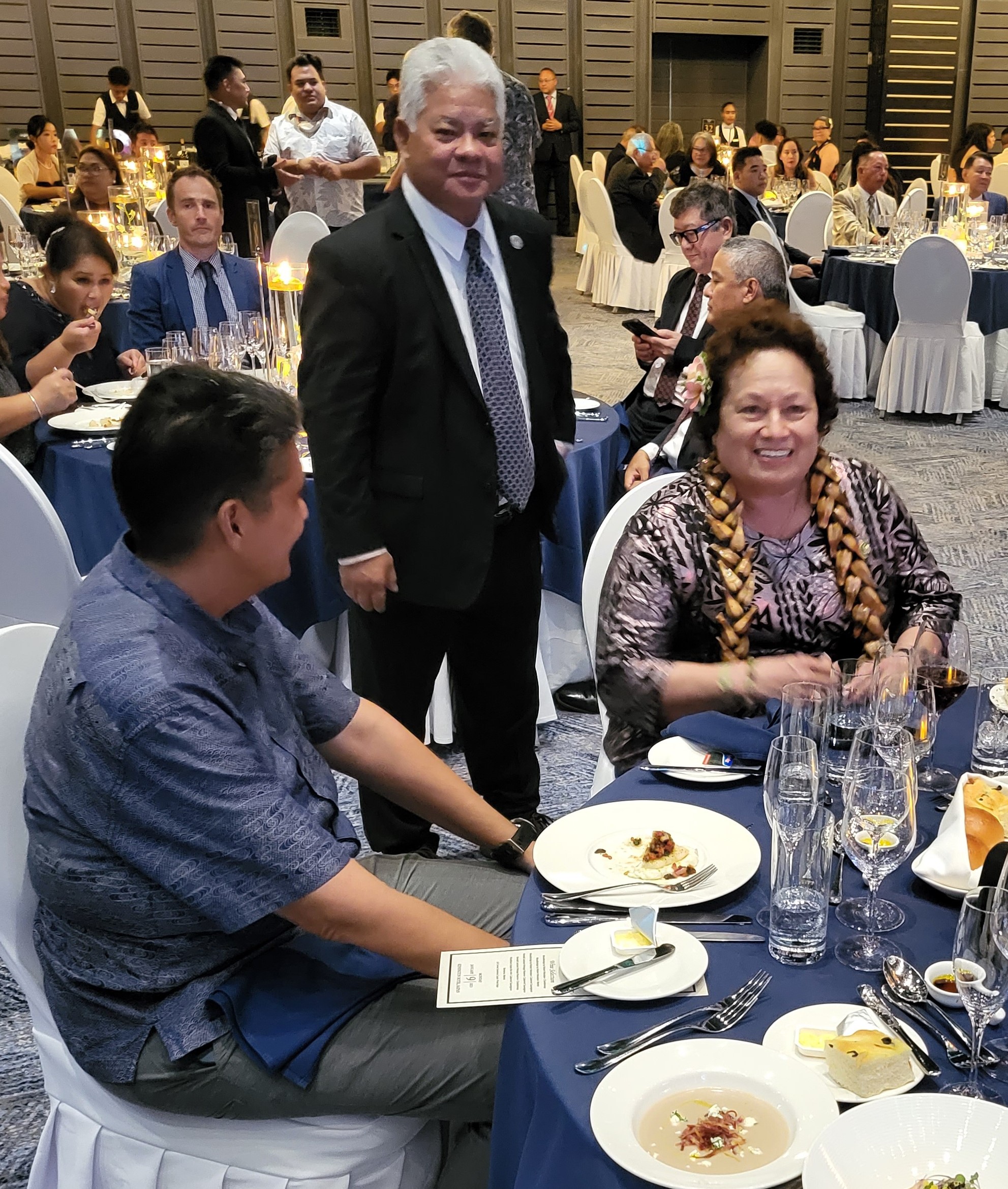 At the CNMI inaugural ball in 2023 speaking with President Whipps of Palau and Governor Palacios of CNMI