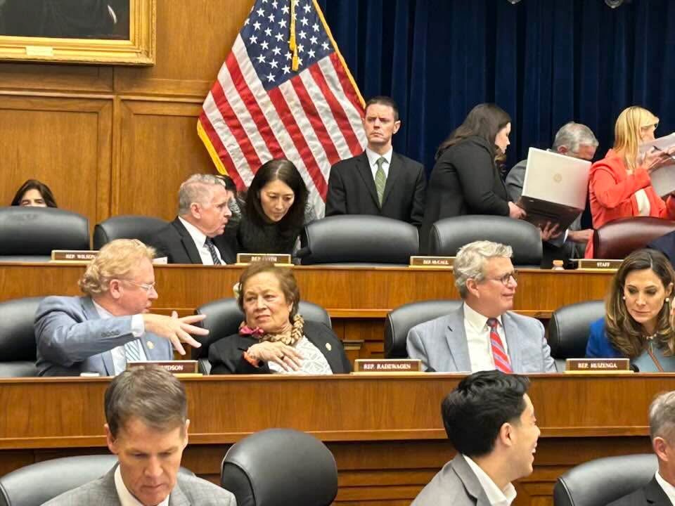 Congresswoman Amata speaking to a colleague during a series of Committee votes on Thursday