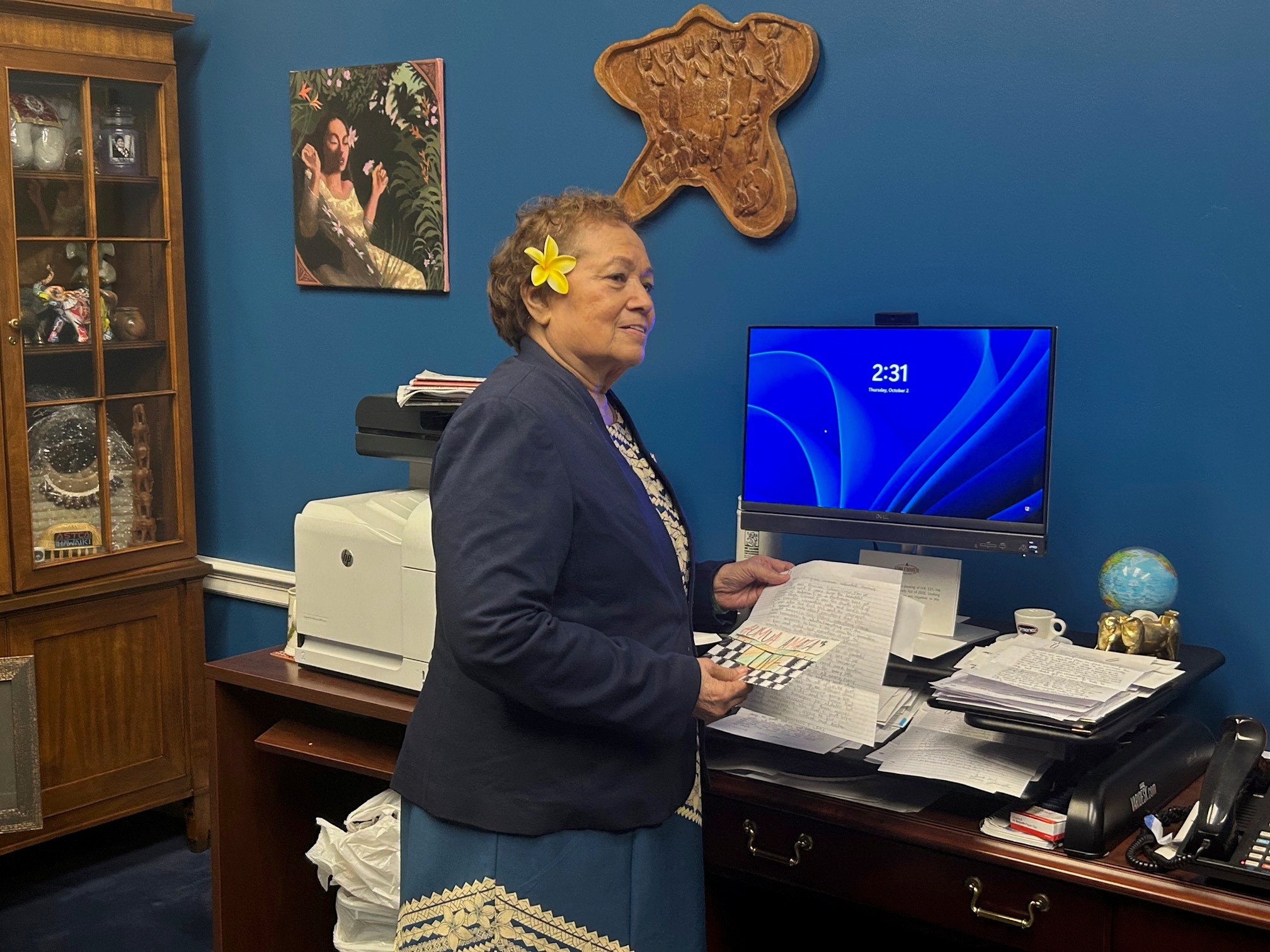 Congresswoman speaking with Teacher of the Year about letters from students