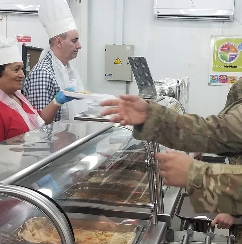 Serving Christmas dinner to troops - file photo