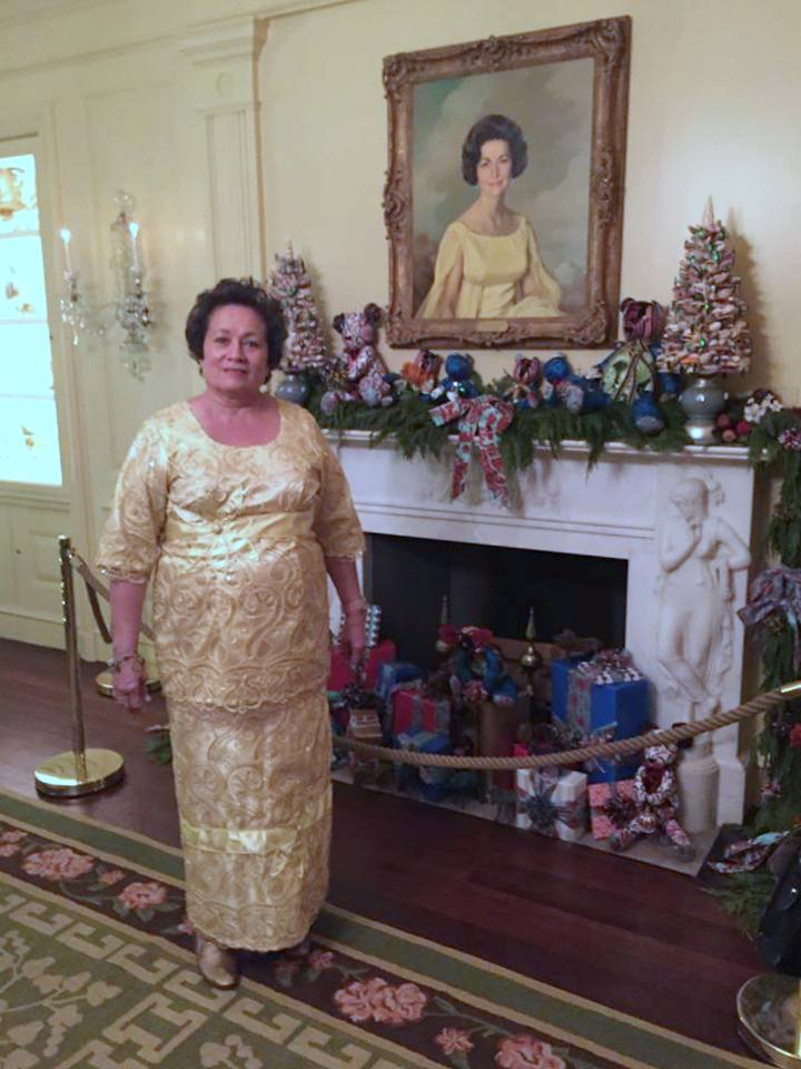 Congresswoman Aumua Amata stands in front of the portrait of Ladybird Johnson at the White House