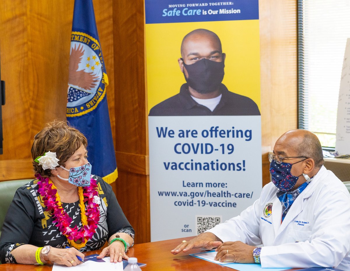 Congresswoman Amata and Dr Adam Robinson discussing Veterans' health services