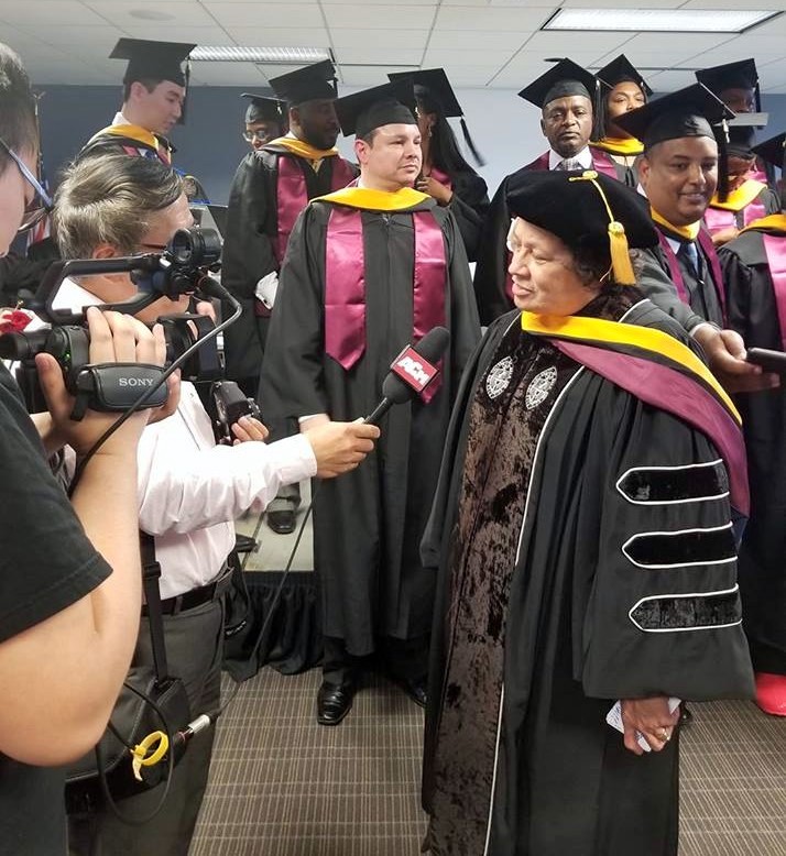 Congresswoman Aumua Amata speaks to the press after receiving honorary Ph.D