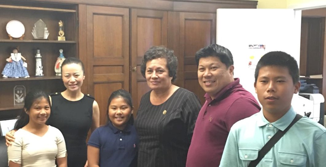 In this file photo, a younger Victor Chen (right) and the Chen family with Congresswoman Amata at the congressional office