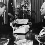 Governor Coleman in the Oval Office presenting President Reagan a specialty license plate from American Samoa