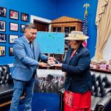 Kaneko presenting Amata a traditional gift