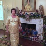 Congresswoman Aumua Amata stands in front of the portrait of Ladybird Johnson at the White House