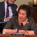 Amata speaking at a Committee hearing