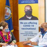 Congresswoman Amata and Dr Adam Robinson discussing Veterans' health services