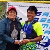 Congresswoman Amata congratulating Victor Chen following sailing competition 