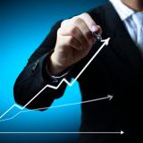 Business man hand drawing a graph