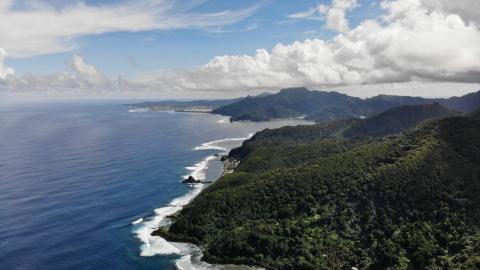 A 2019 coastal view of American Samoa and mountainous tropical forest