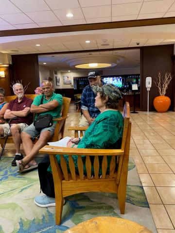 Amata speaking with veterans who thanked her for her work and alerted her to issues in their services and care.