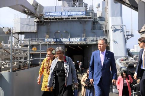 Signs aboard the USS Gunston Hall - Defending The Constitution and Deck Stands Ready