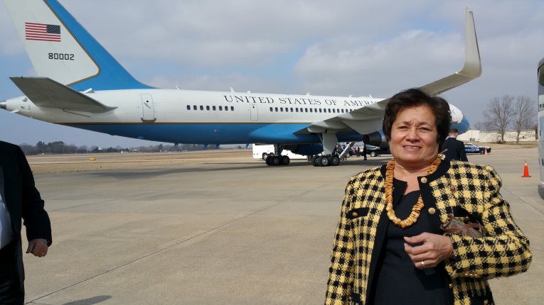 Congresswoman Aumua Amata in front of Air Force Two