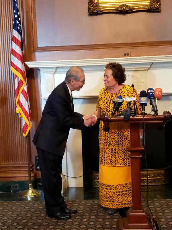 Congresswoman Amata greeting Representative to the US Stanley Kao