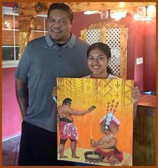 artist and father with artwork