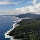 A 2019 coastal view of American Samoa and mountainous tropical forest