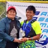 Congresswoman Amata congratulating Victor Chen following sailing competition