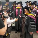 Congresswoman Aumua Amata speaks to the press after receiving honorary Ph.D