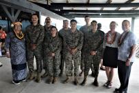 Reps Amata, Moylan, and Melanie Stansbury with US military members
