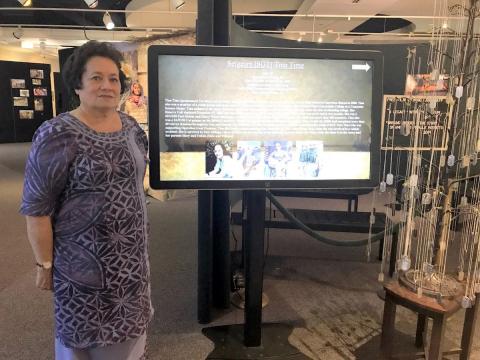 In this file photo, Amata is visiting a memorial to the heroic life of Sgt. Tina Safaira Time, who grew up in American Samoa, displayed at the Army Women’s Museum in Virginia