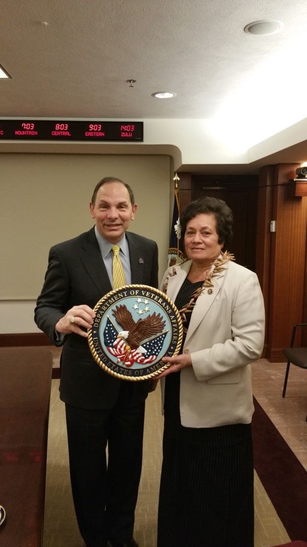   VA Secretary Robert McDonald presents the department seal to Congresswoman Amata